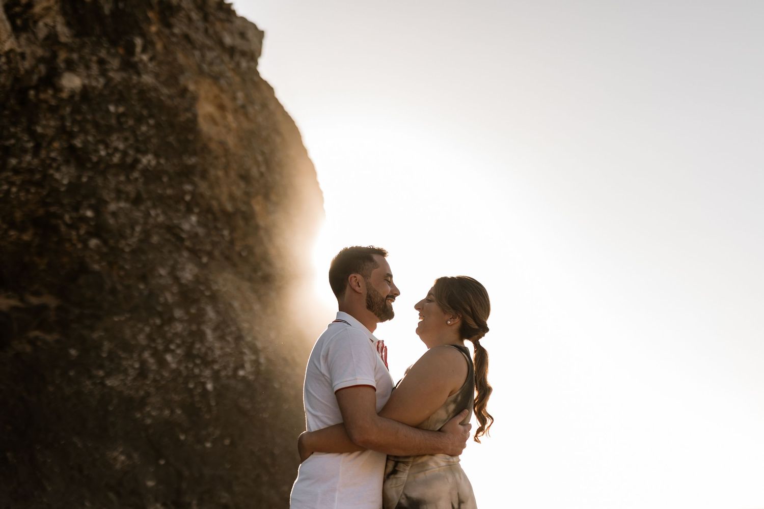 Golden hour couple portrait by the cliffs at Praia da Adraga engagement photoshoot Portugal