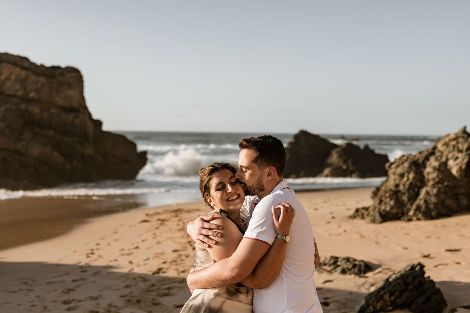 Candid moment of couple laughing during pre wedding session at Praia da Adraga Sintra