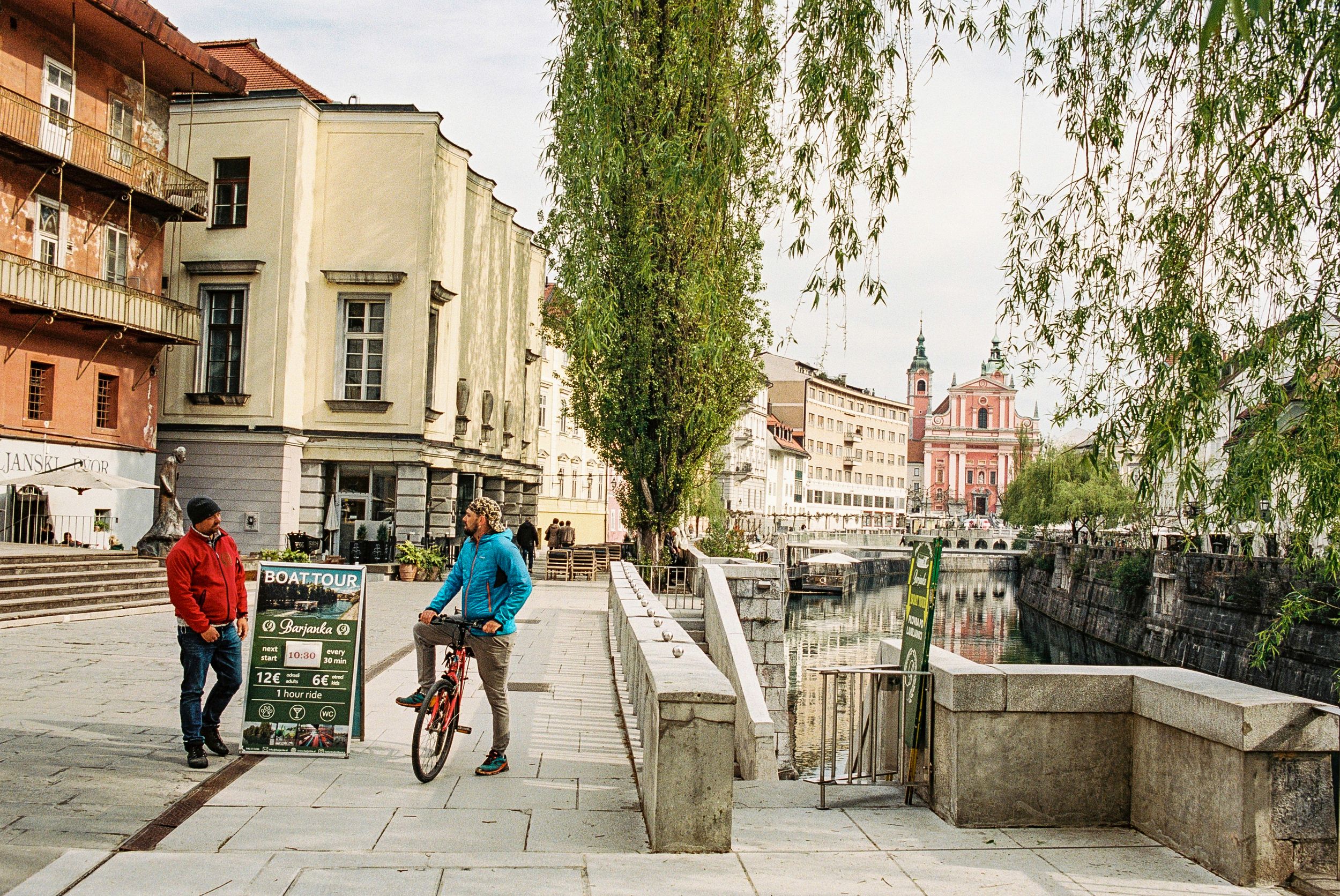 A picturesque view of Ljubljana, Slovenia, featuring the iconic Triple Bridge, Ljubljana Castle, and the charming Old Town. Discover the bes