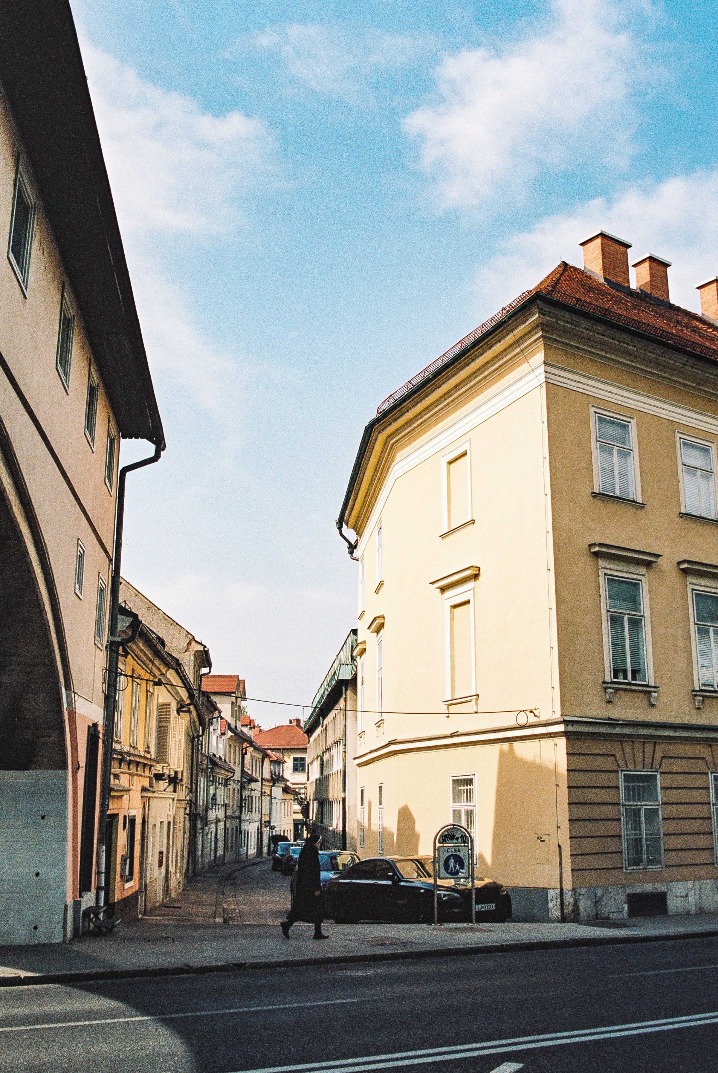 A picturesque view of Ljubljana, Slovenia, featuring the iconic Triple Bridge, Ljubljana Castle, and the charming Old Town. Discover the bes