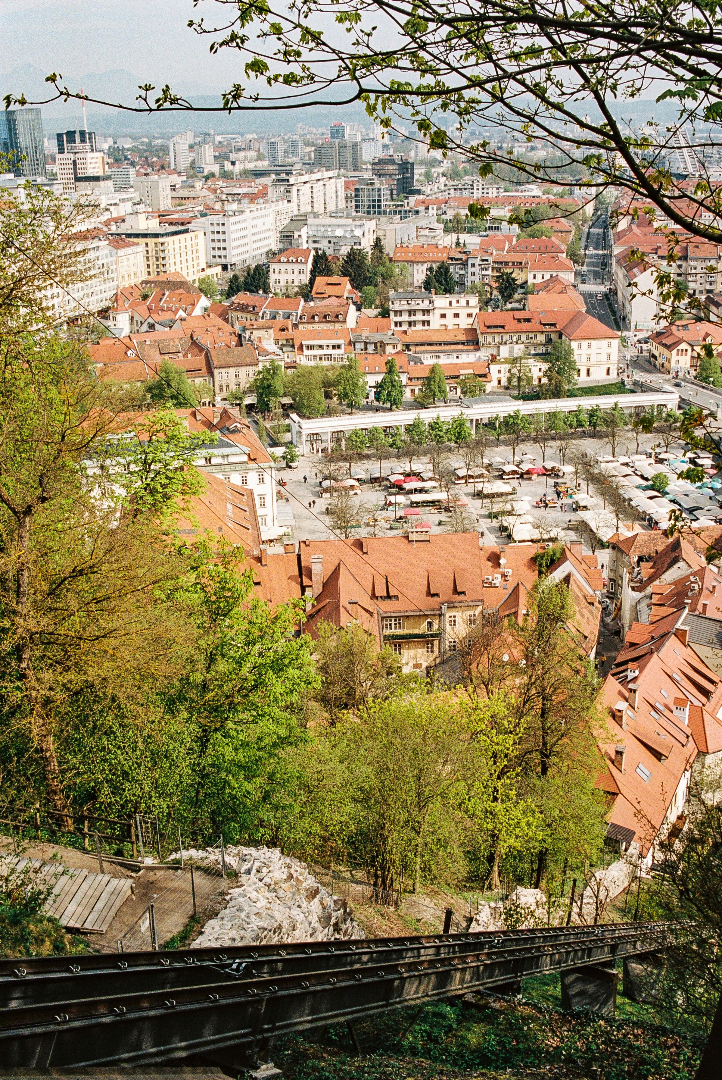 A picturesque view of Ljubljana, Slovenia, featuring the iconic Triple Bridge, Ljubljana Castle, and the charming Old Town. Discover the bes