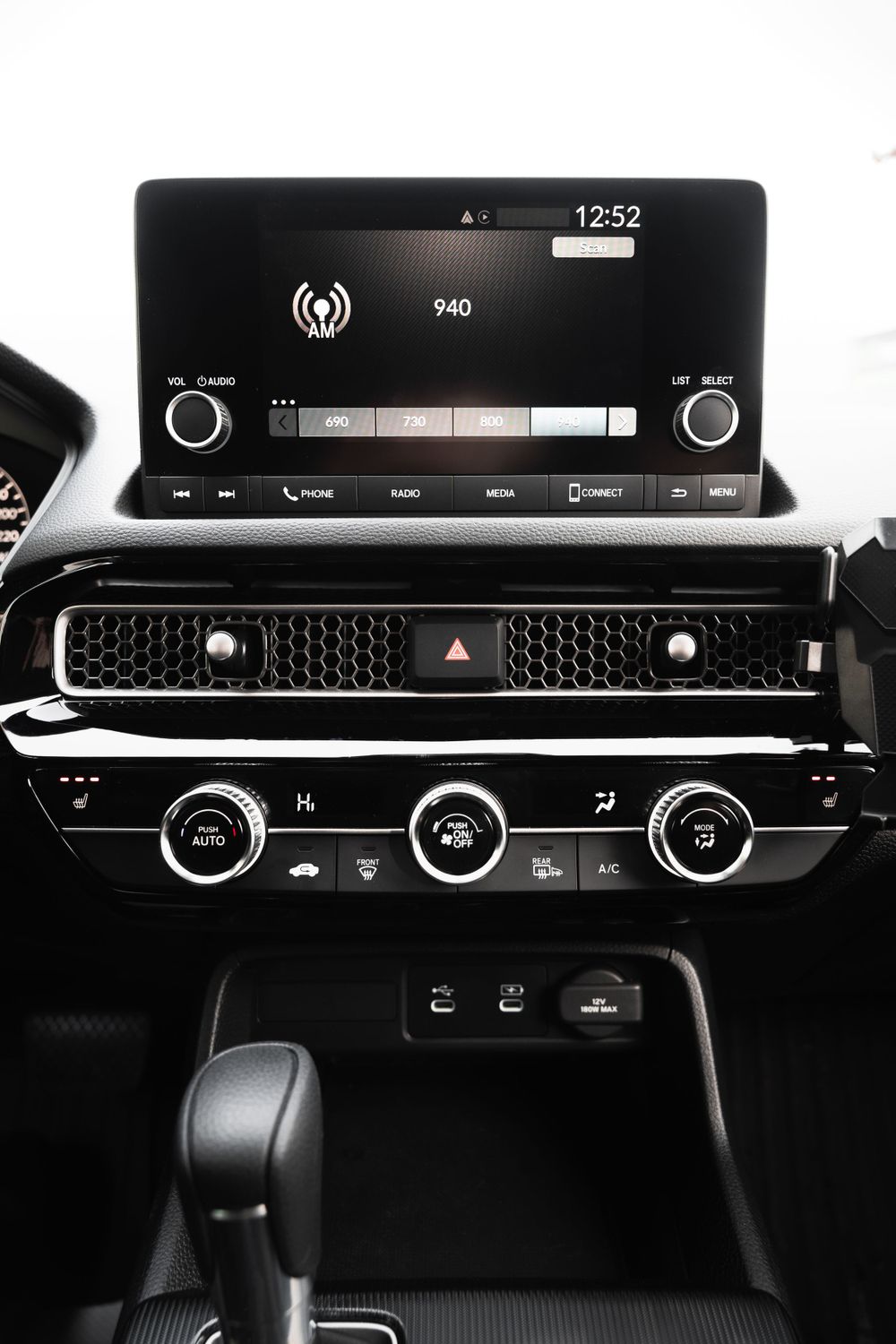 Modern car dashboard showing infotainment system and climate controls. Mtlshutter photography