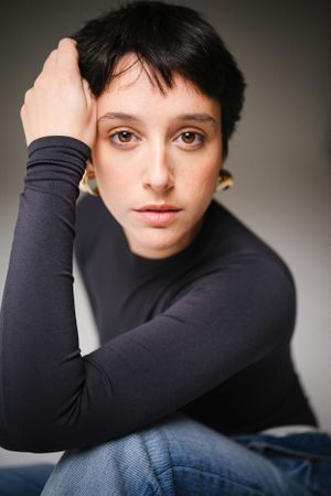Intimate portrait showing contemporary casual style in studio lighting.