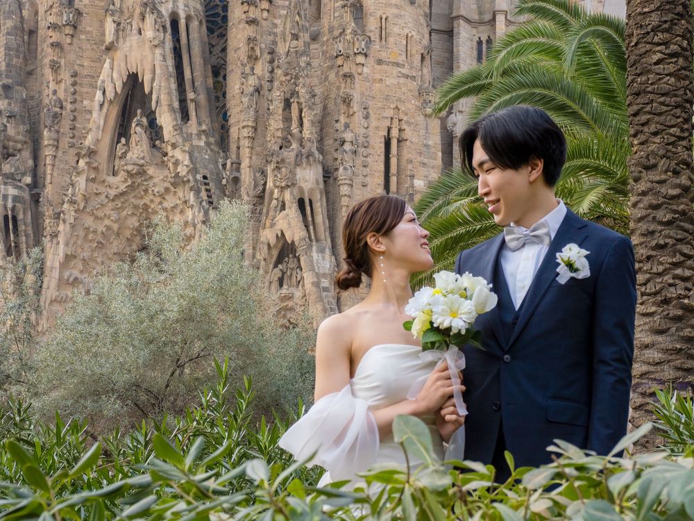 A romantic post wedding photoshoot in front of the Sagrada Familia with beautiful natural lighting.
