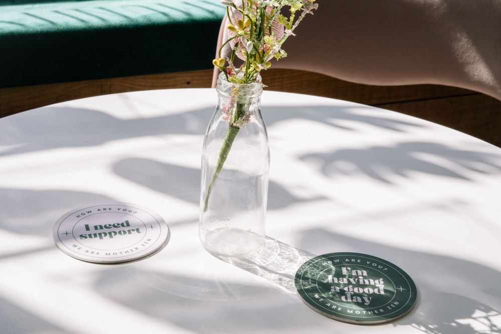 Sunlit table setting with delicate vases and elegant table decor casting soft shadows.
