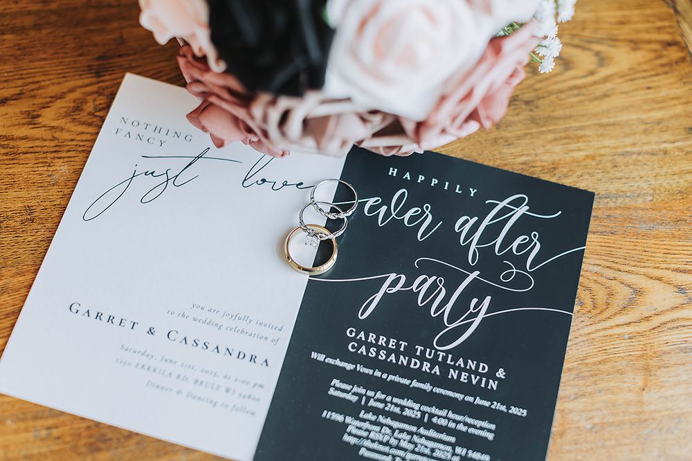 Wedding stationery featuring black and white invitations with calligraphy text for a reception after party.