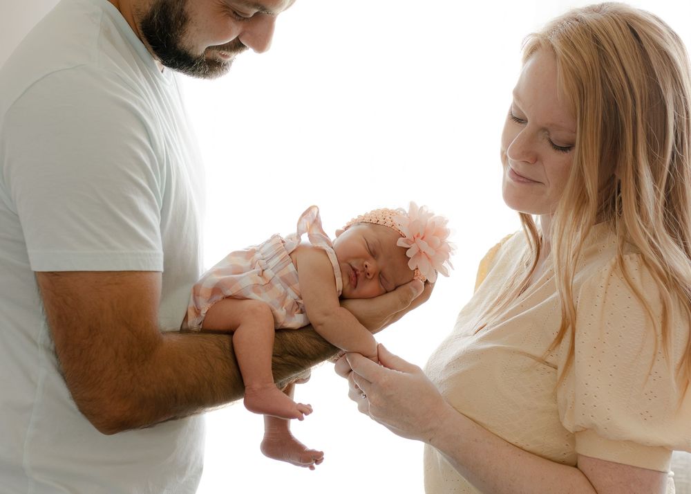 Parents playfully lifting and interacting with baby in a joyful sequence of photos.