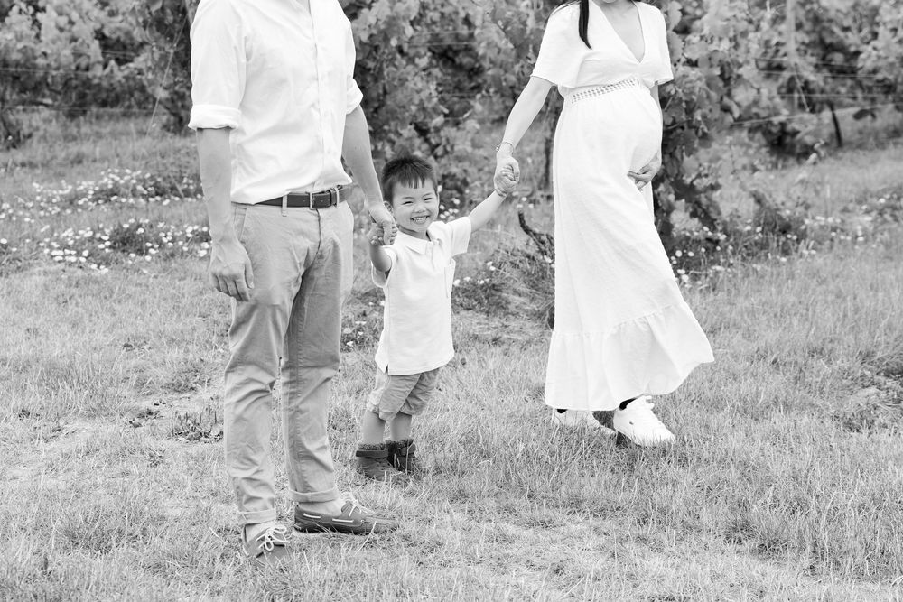Black and white photo series showing people in summer attire walking together outdoors in a natural setting.
