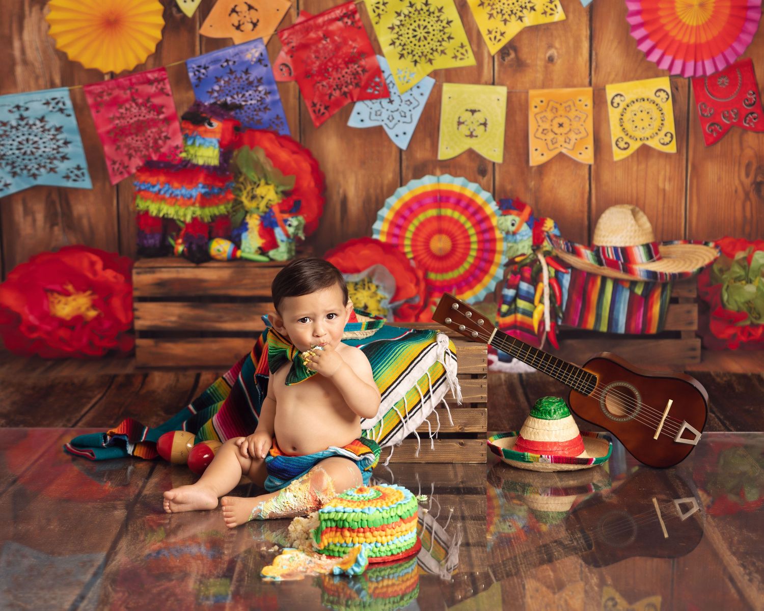 Colorful fiesta themed set with Mexican party decorations and props.