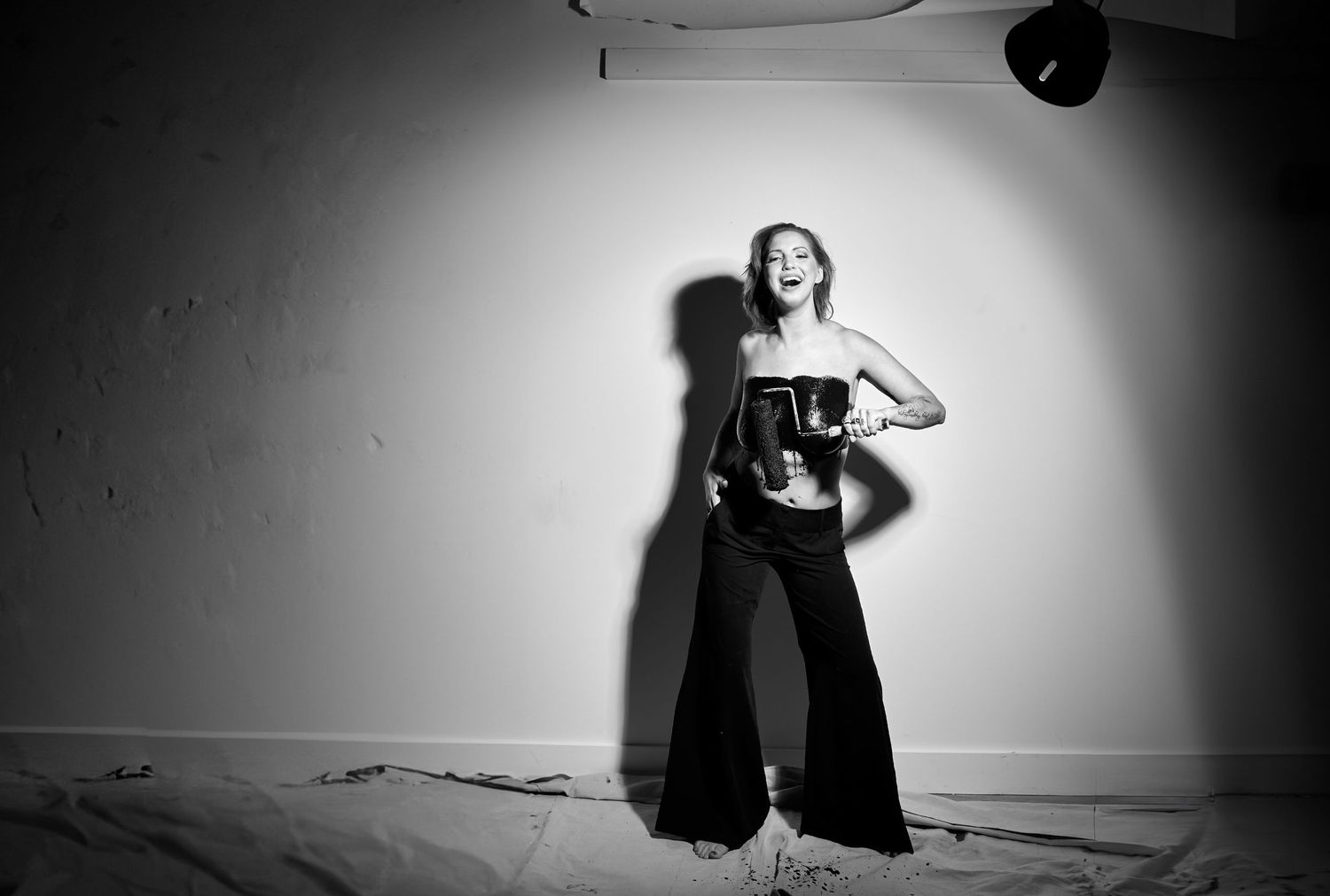 Dramatic black and white photo series with artistic lighting and dynamic poses.