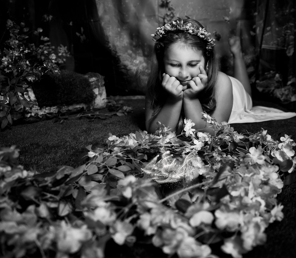 A series of black and white wedding photographs showing intimate moments with floral details and natural lighting.