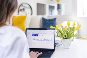 Jessica Stegner Seattle SEO consultant woman business owner branding overshoulder google business overview of site on laptop on table