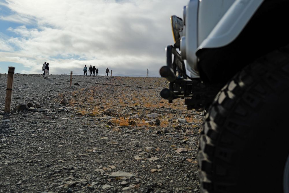 Offroad vehicle tire parked on a rocky road