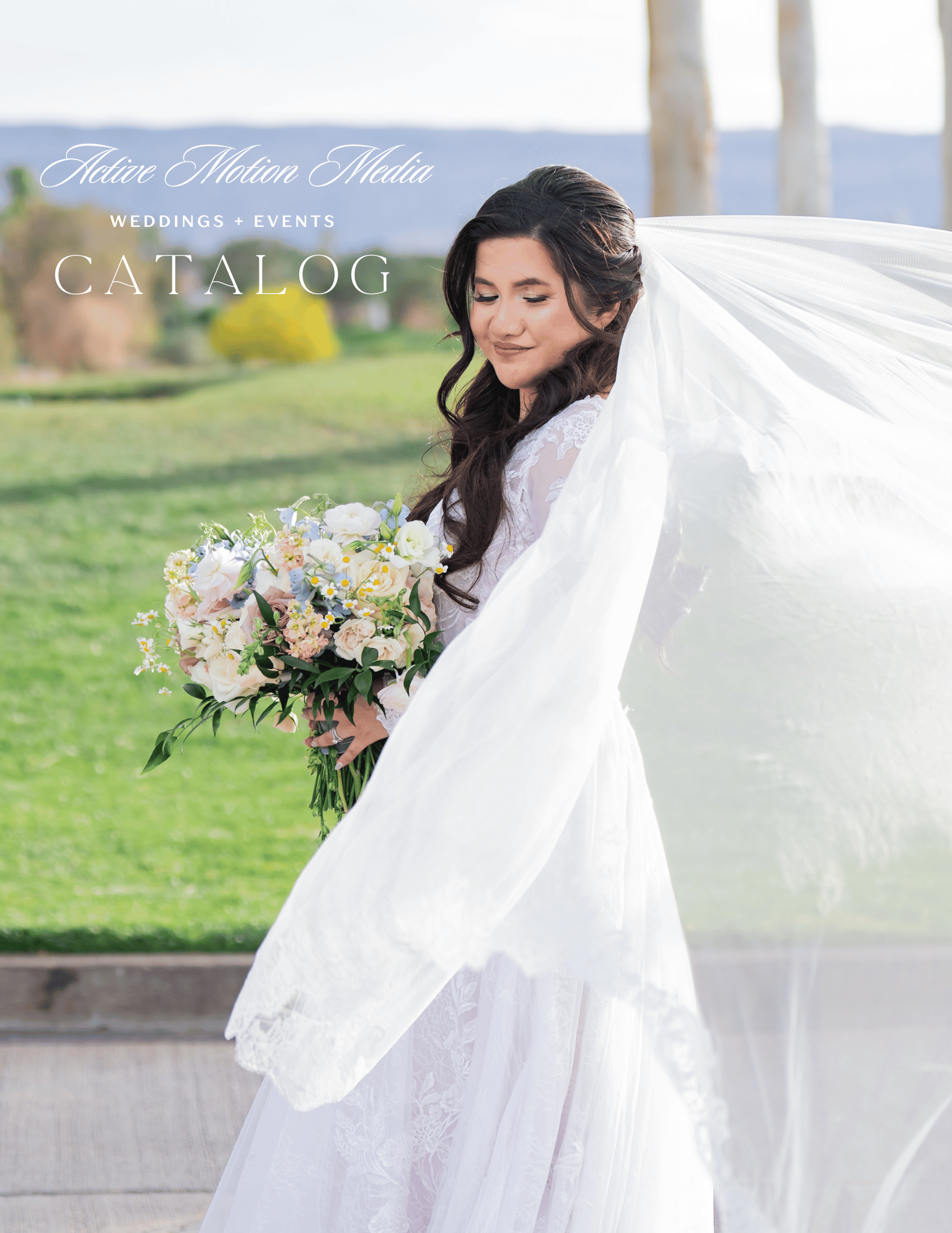 Ethereal outdoor wedding photography with flowing white veil catching the breeze.