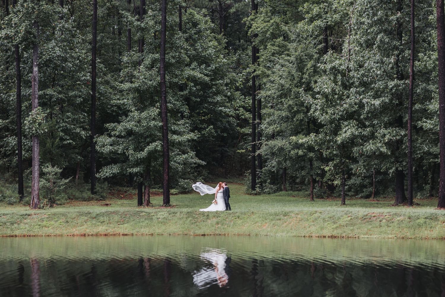 A bride and groom pose in dreamy sunlit woodland settings during their wedding photoshoot.