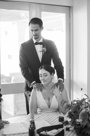 Intimate wedding moments captured in a sunlit room with elegant decor.