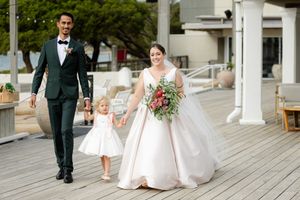 A panoramic sequence of wedding photos shows couples and bridal party members walking on a wooden deck.