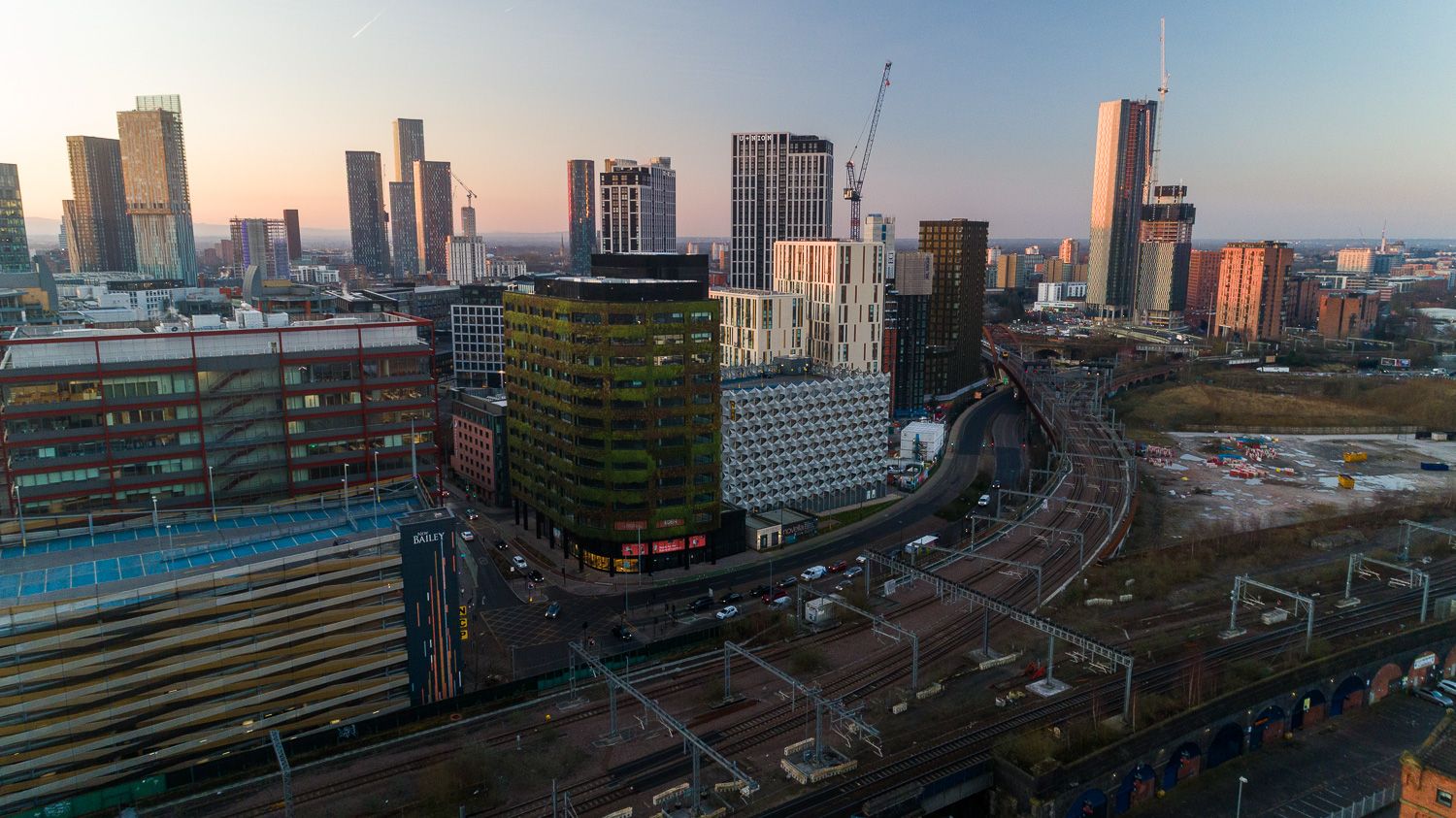 Architectural drone photograph of Eden New Bailey, and Manchester skyline
