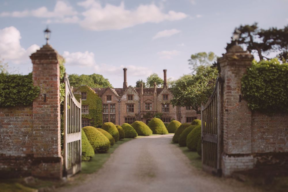 Tilt shift image of the entrance to Seckford Hall in Suffolk on sunny day.