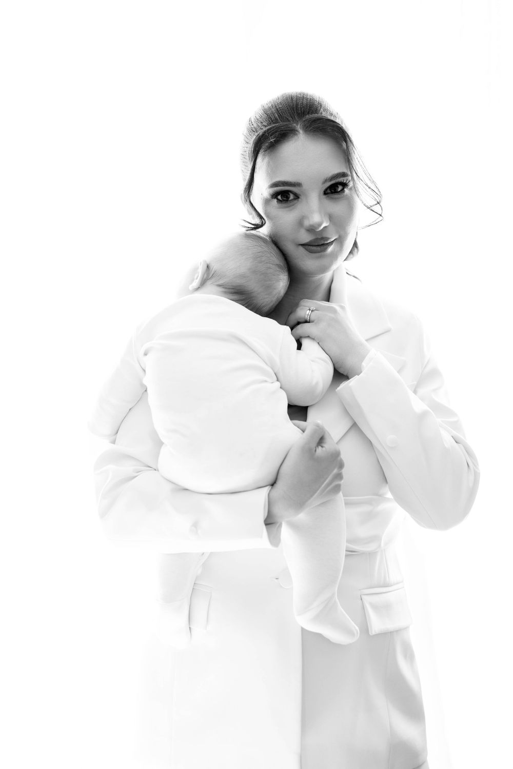 Series of artistic poses in white clothing against a white background.