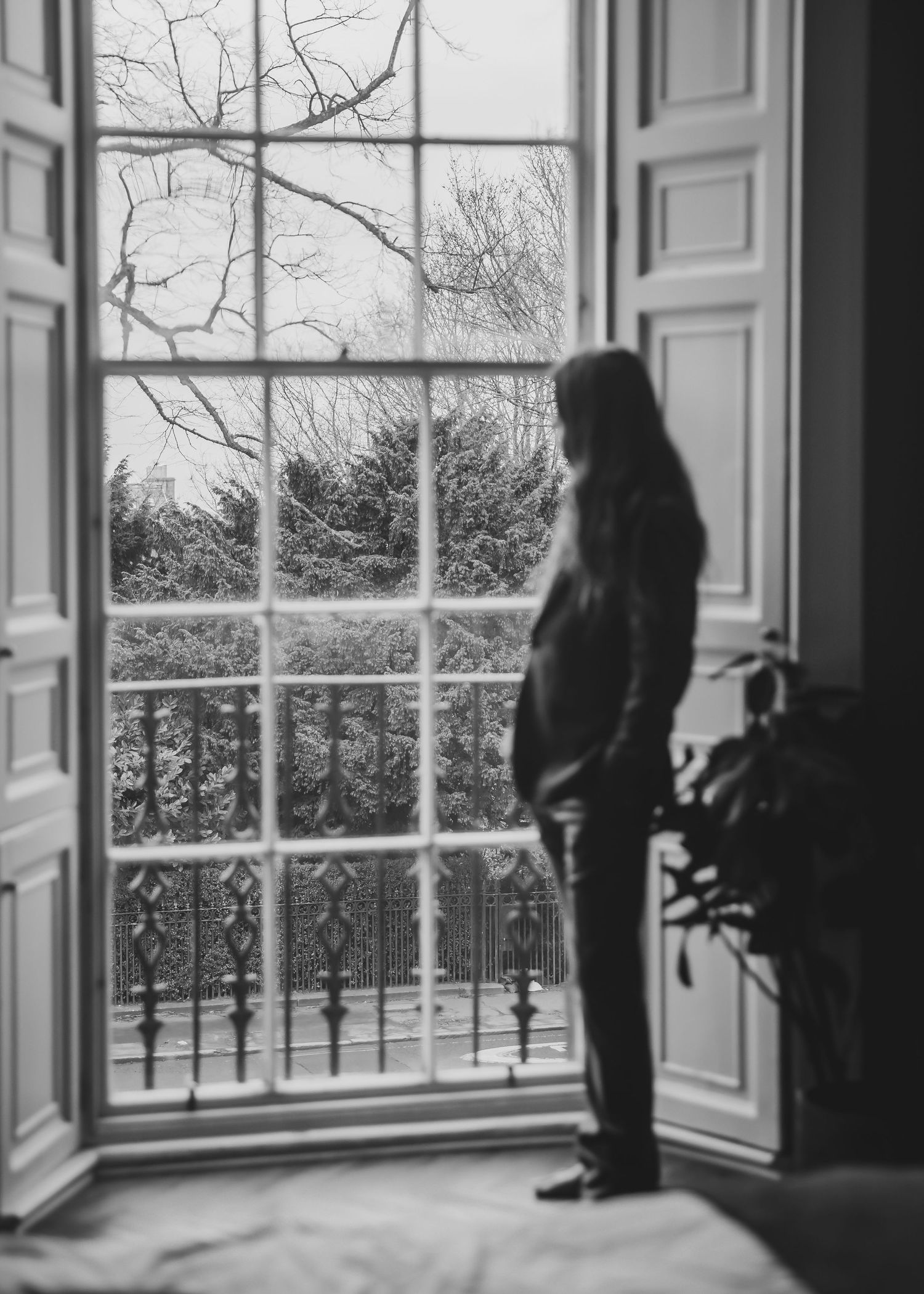 Scottish Elopement Photographer - groom looking out of the window