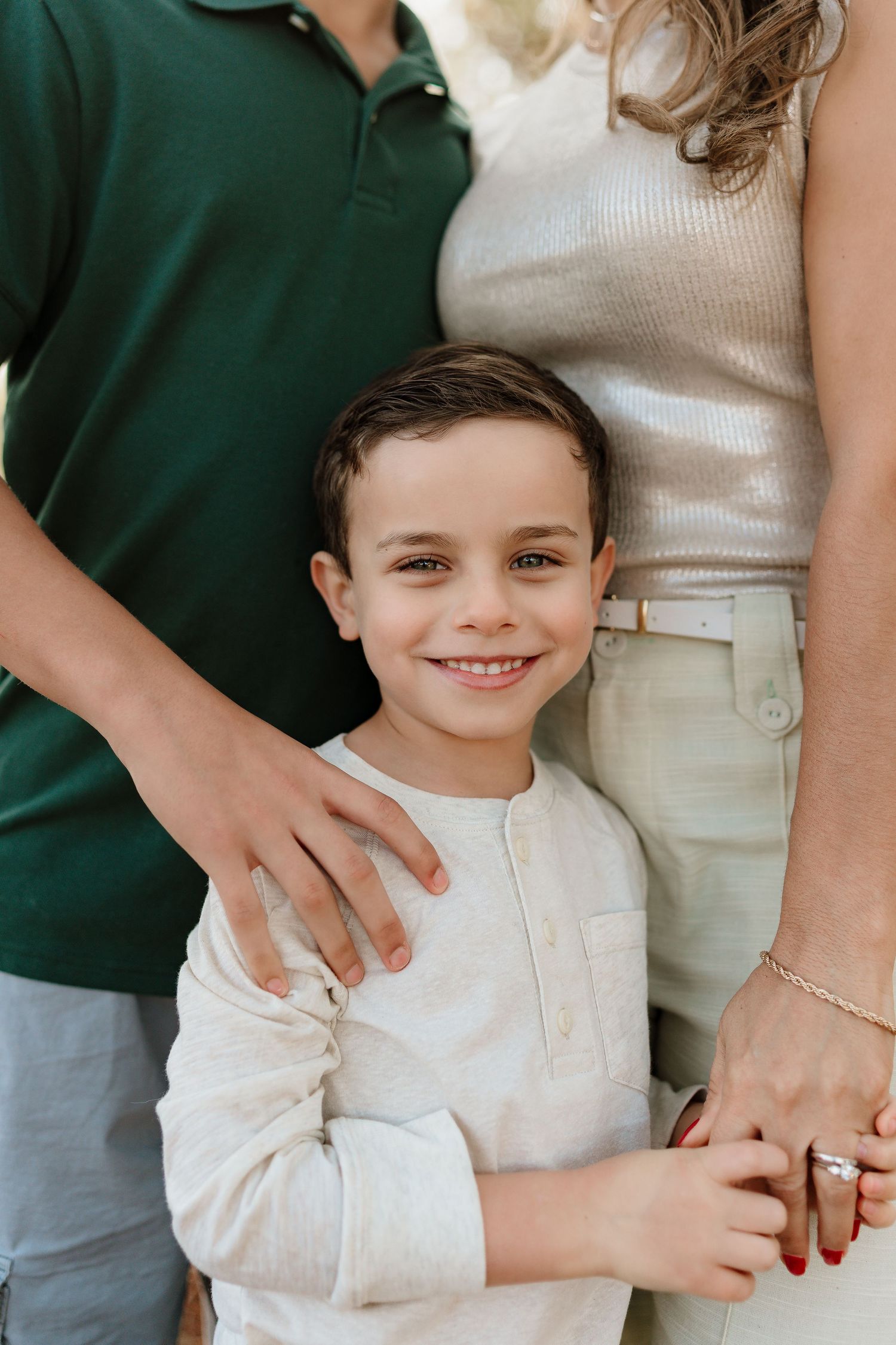 Close-up candid shots showing loving family interaction in casual attire.