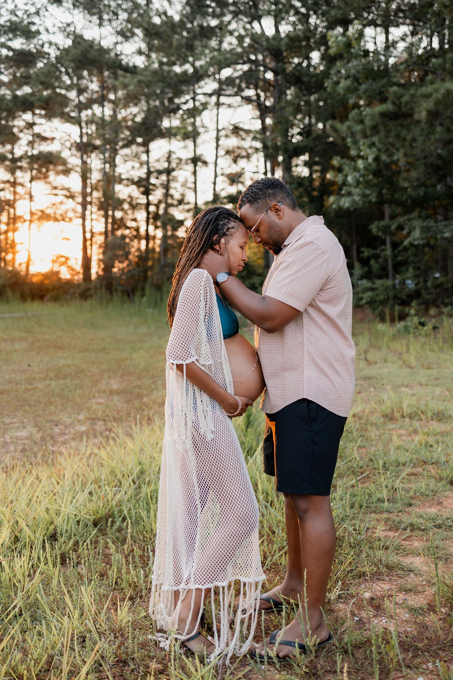 Cozy indoor maternity portraits with soft tones and personal details – lifestyle maternity photography in metro Atlanta studio.