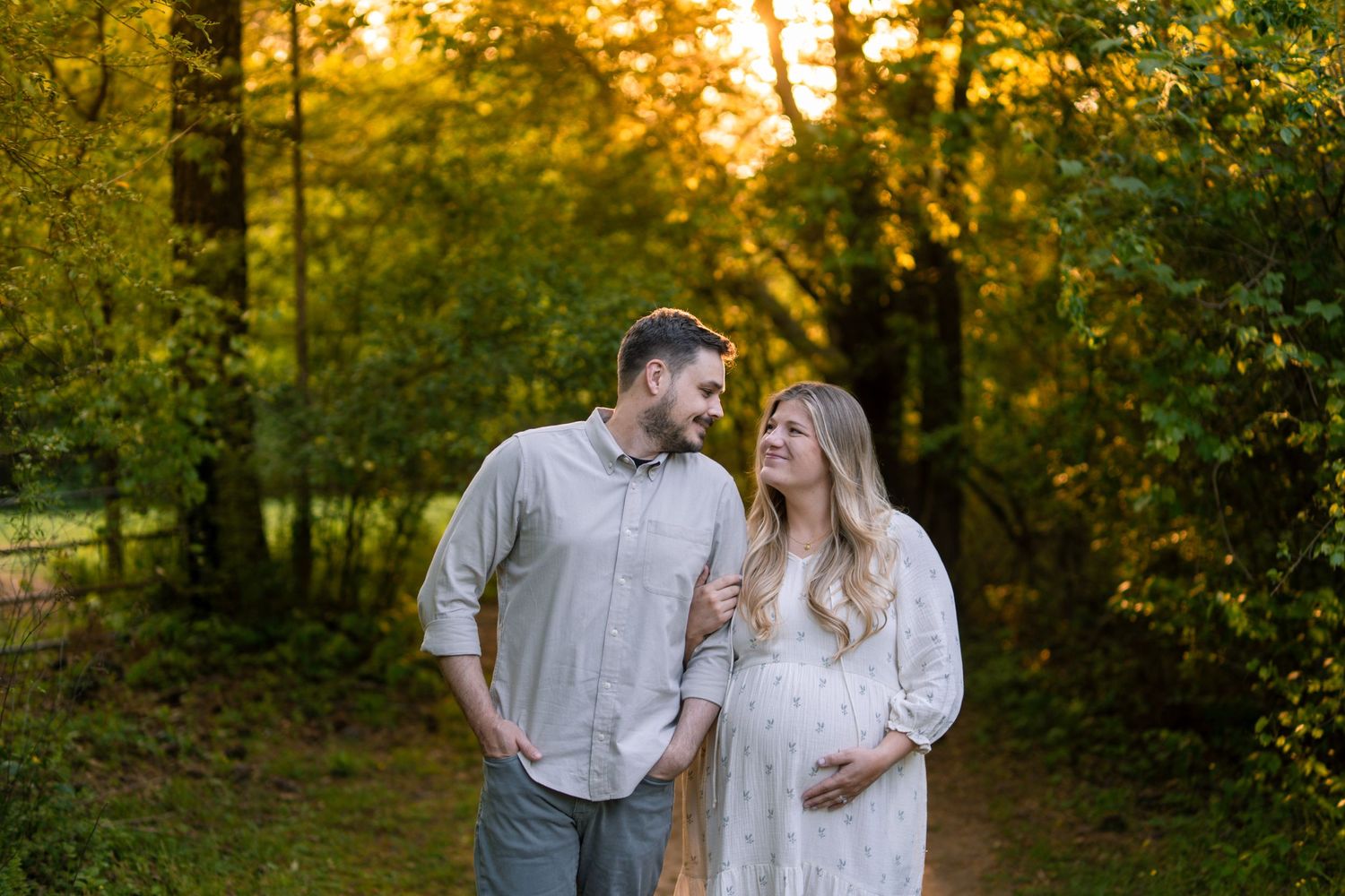 Pregnant wife with husband at a Marietta park maternity session