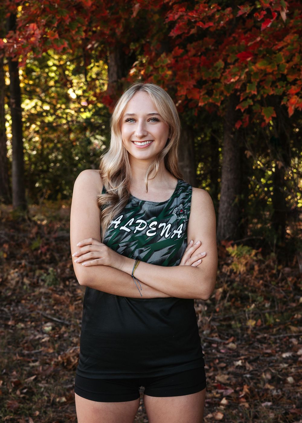 A series of outdoor portraits showing someone in a black tank top against autumn foliage in the background.