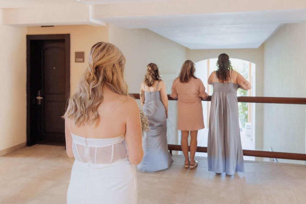 bride dress reveal with bridesmaids and mother of the bride Mexico resort wedding photography Cancun photographer packages from Canada