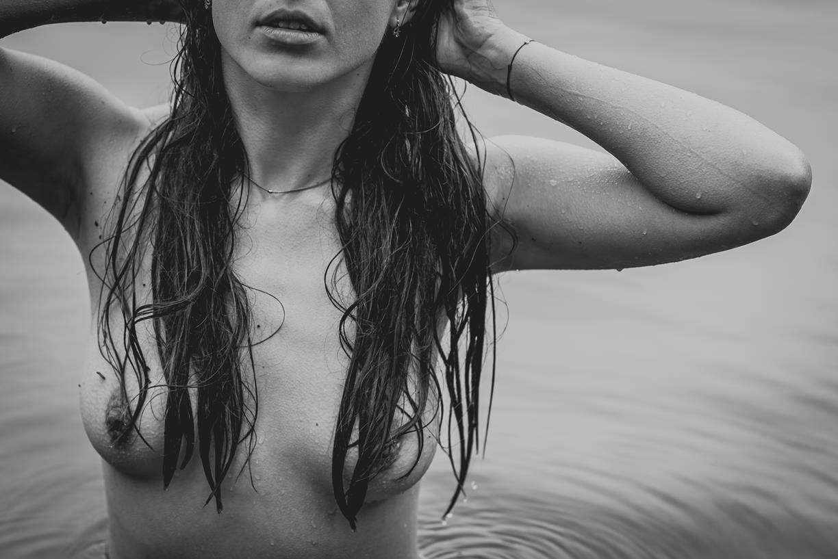 Dramatic monochrome portrait with wet hair effect.