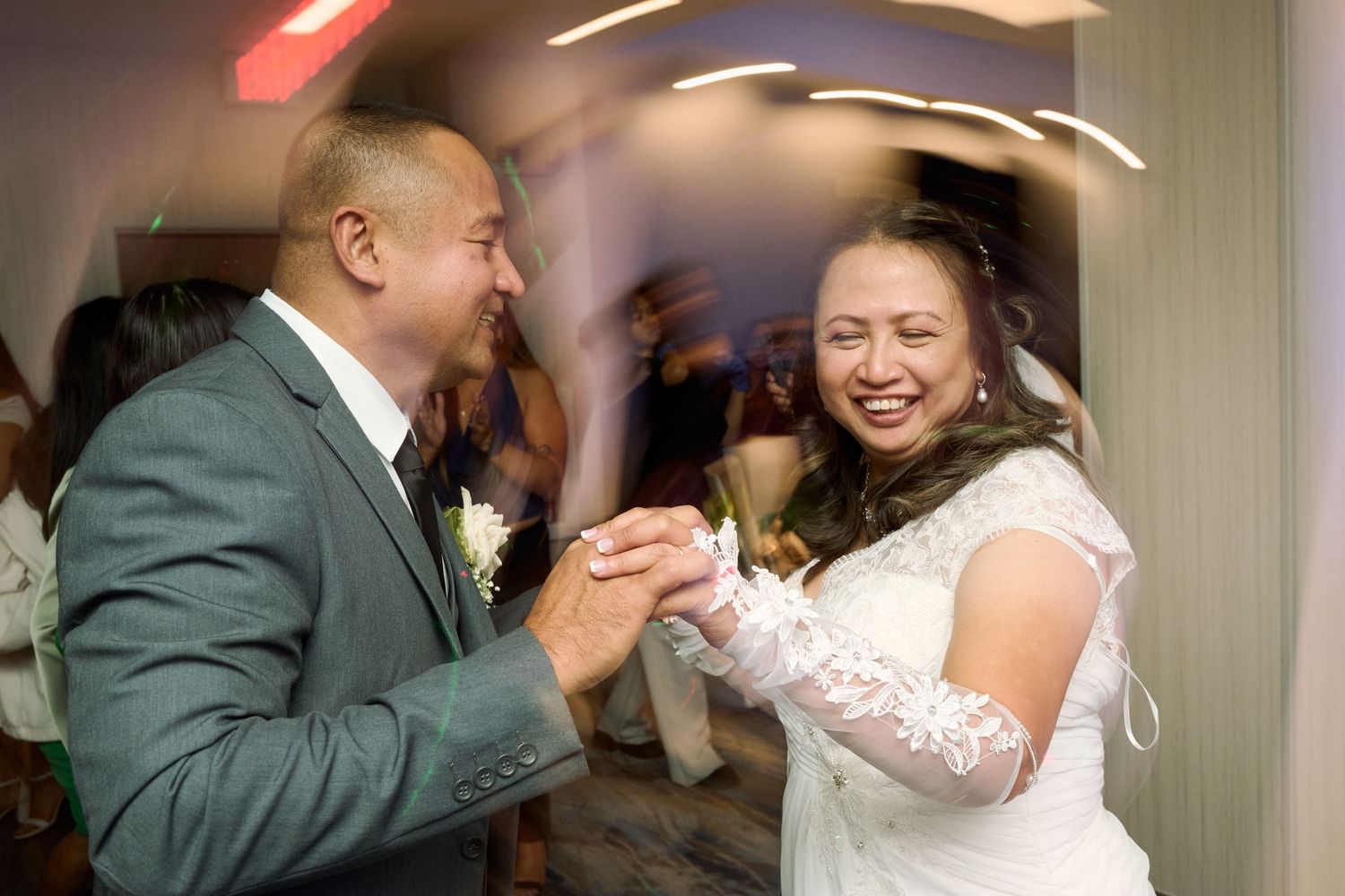Wedding couple shares a romantic dip during their first dance at the reception.