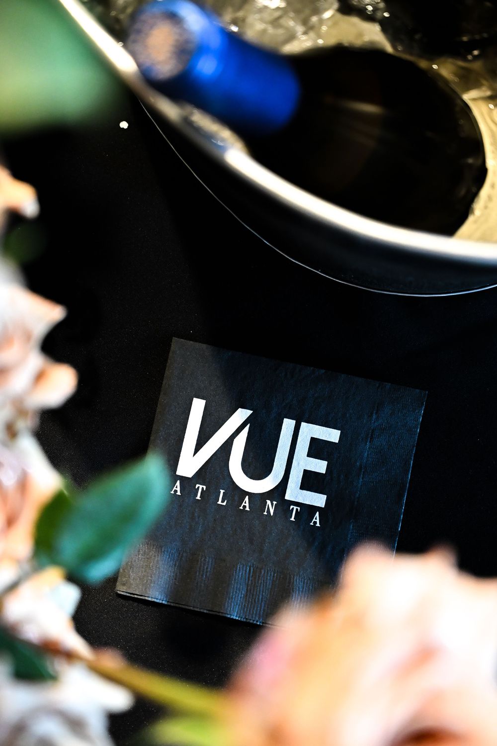 Blurred closeup of signage or text displaying 'VUE' in white letters against a dark contrasting background.