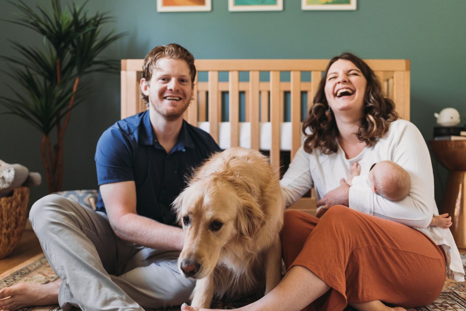 A group enjoys relaxing together with a friendly dog in a cozy home setting.