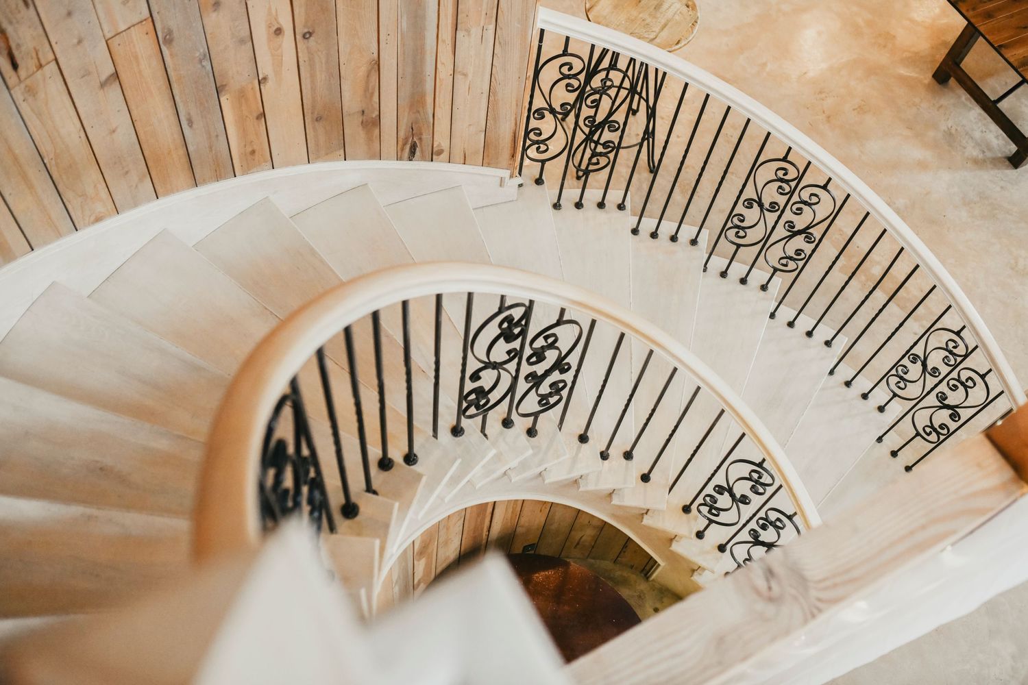 White wooden staircase with a modern rustic design and delicate charm inside whispering oaks wedding venue in denton texas