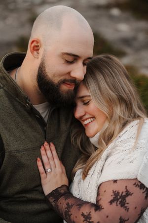A romantic couple shares intimate moments in a series of close-up engagement photos showing affection and joy.