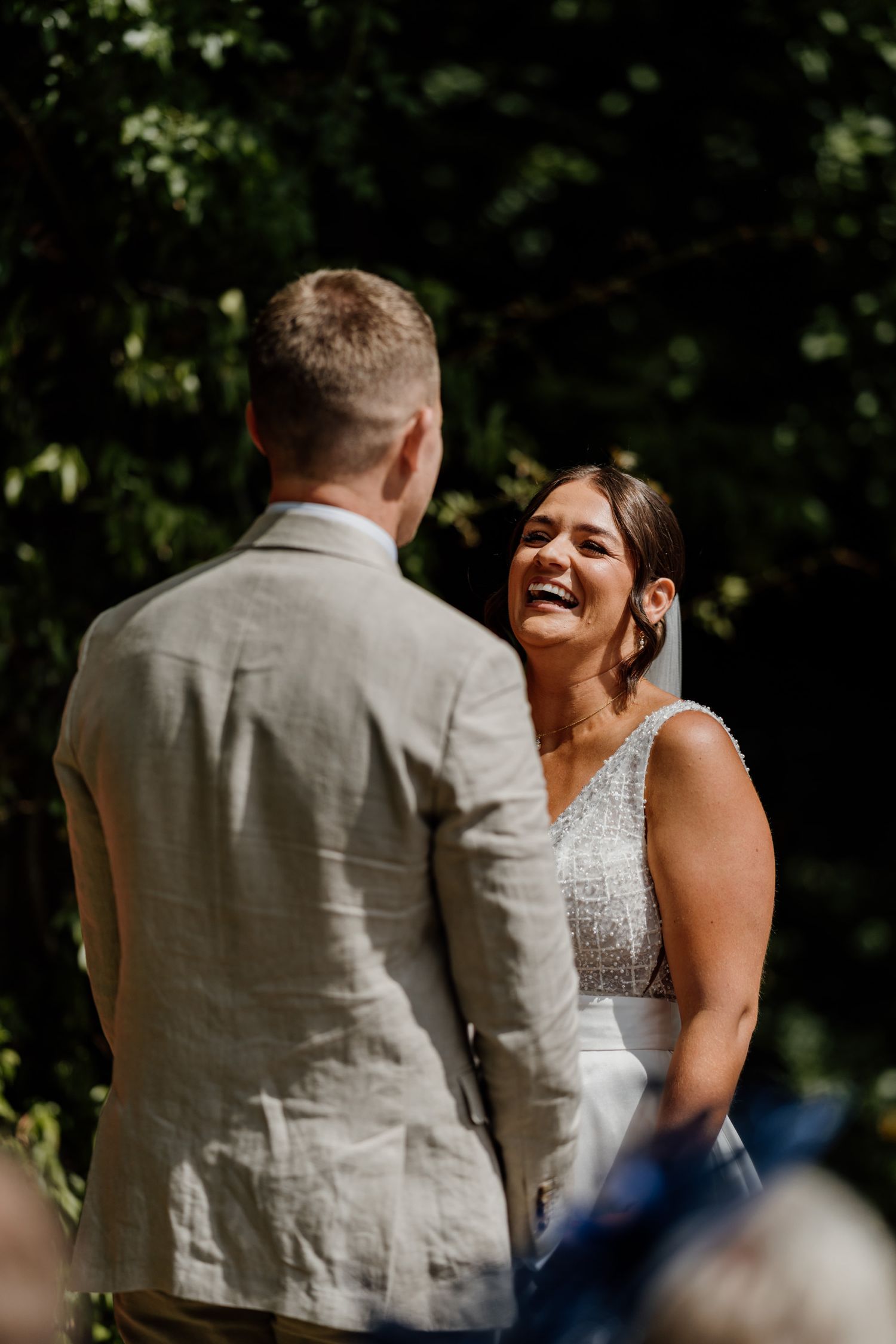 Candid sequence of joyful moments shared between couple during sunny outdoor celebration.