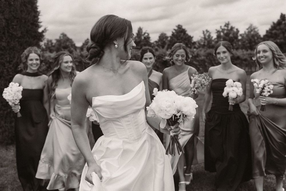 Black and white wedding photos showing candid moments of celebration.