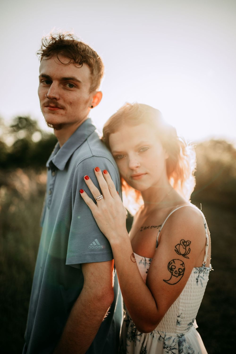 Intimate sunset portrait session showing couple in casual summer outfits.