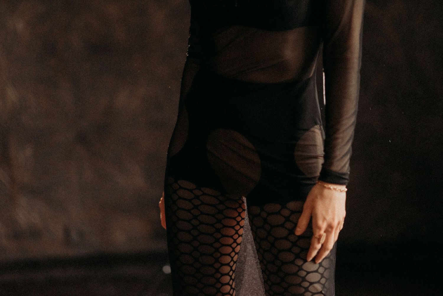 Close-up sensual silhouette of a woman’s hips – boudoir photoshoot in a studio setting