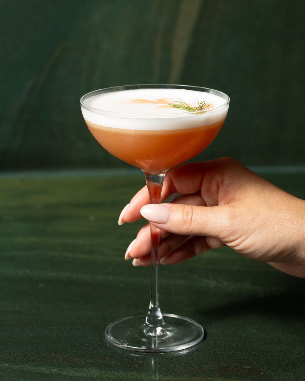 Food photography for Daphne featuring an orange cocktail.