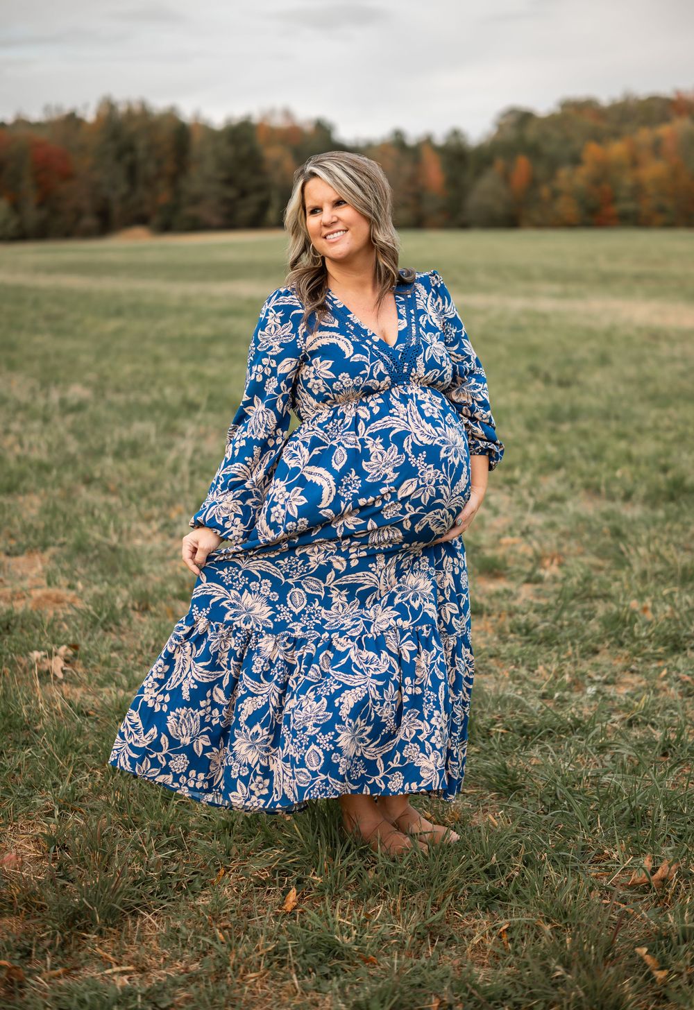 woman posed in field of flowers
