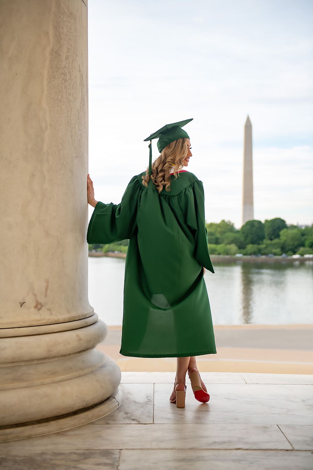 Artistic silhouette shots of graduate against Washington Monument and Tidal Basin backdrop.