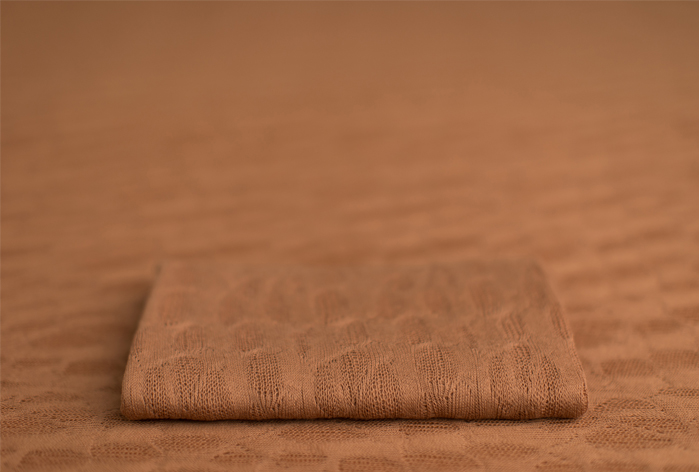 Dusty orange toned wrap for newborn baby photography setups