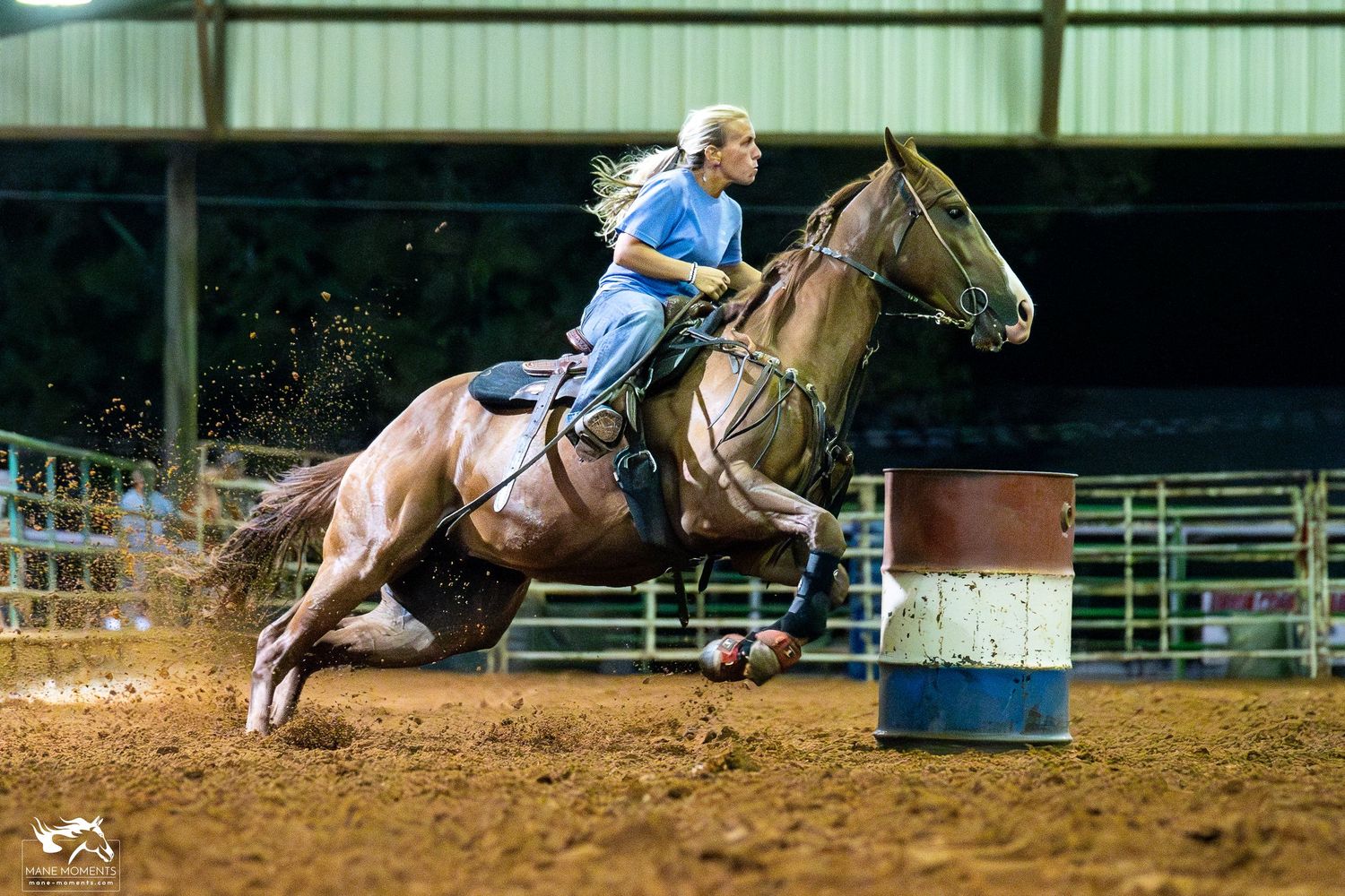 A horse and rider navigate a barrel racing course at high speed in sequential action shots in a dusty indoor arena.