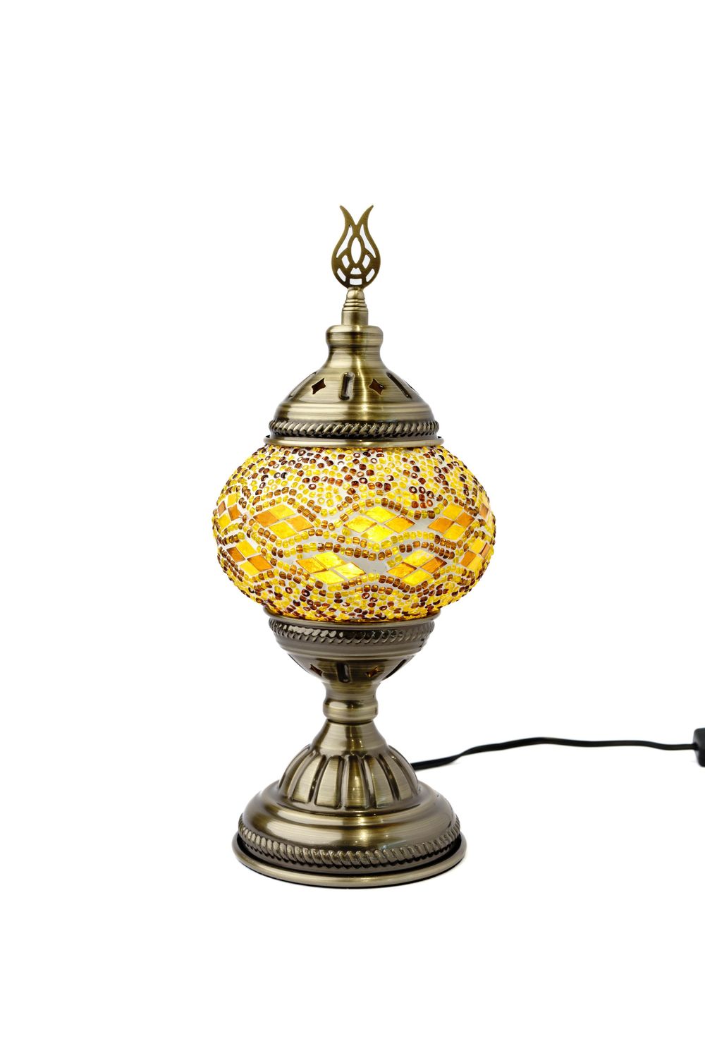 A decorative Turkish mosaic table lamp with amber glass and bronze metalwork featuring intricate patterns.