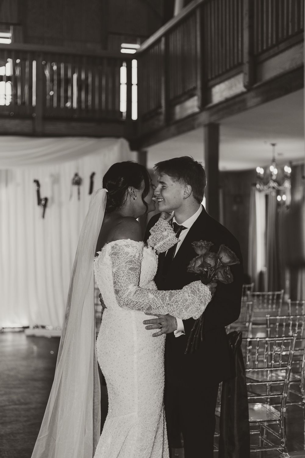 Wedding reception venue with clear chairs and elegant decor showing intimate dance moments.