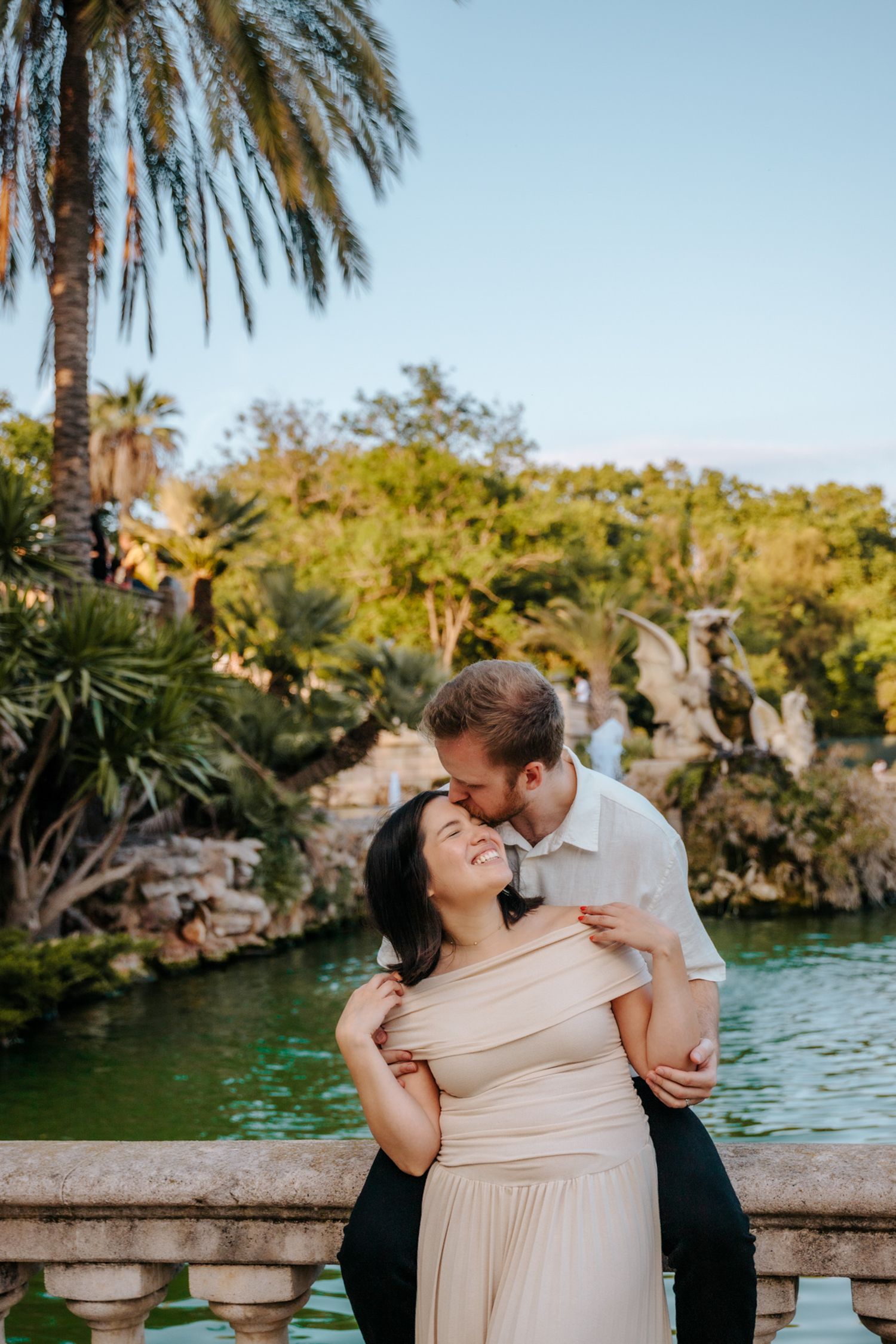 Forehead touch captured during their honeymoon session in the park.