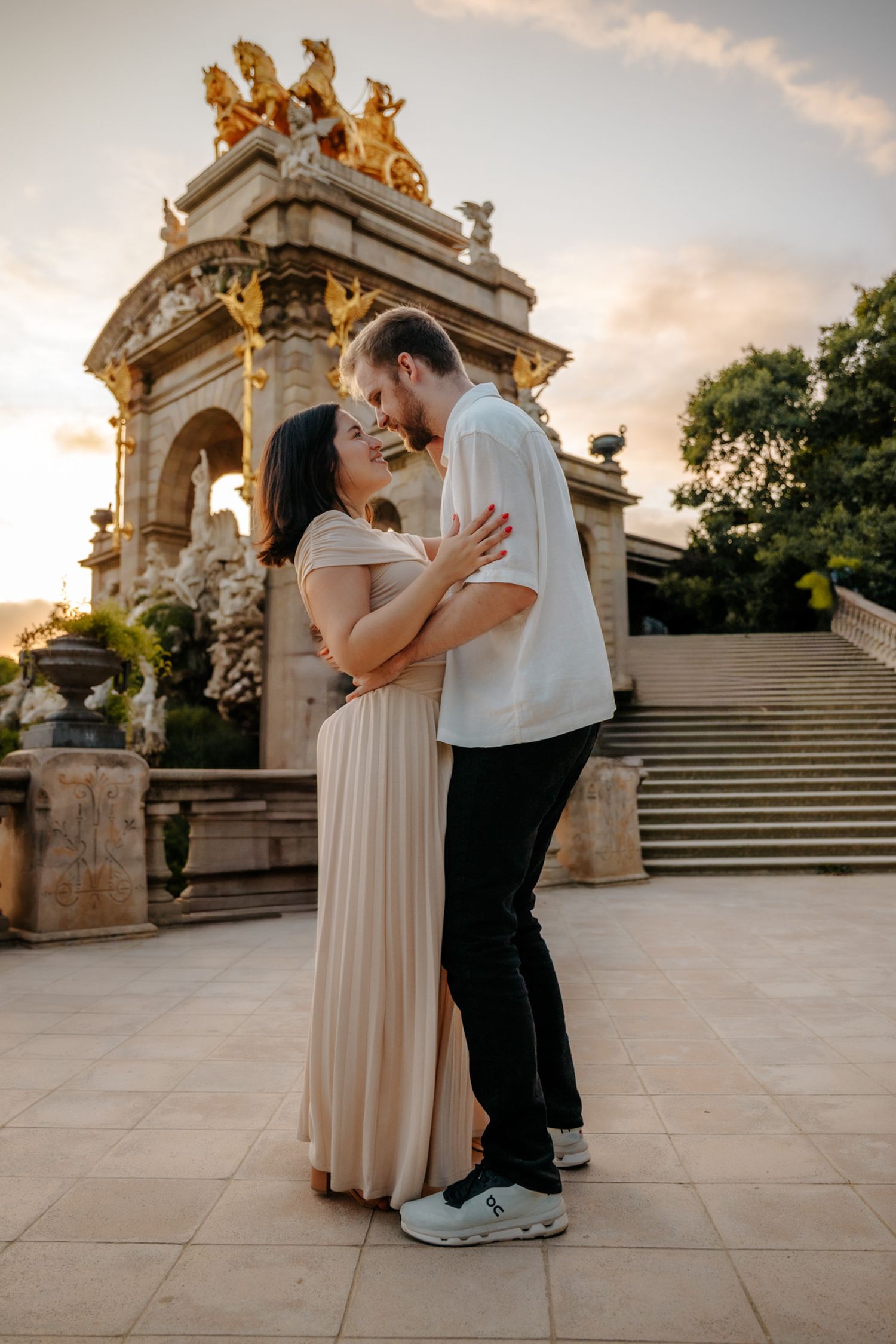 Tender embrace captured in golden afternoon light of the park.