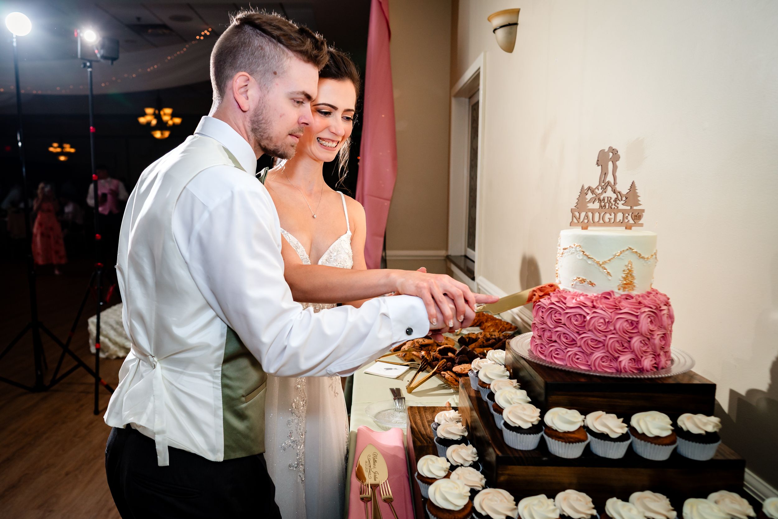 Couple shares a sweet moment during their wedding cake cutting ceremony.